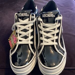 Skechers Glossy Black and White Platform Sneakers